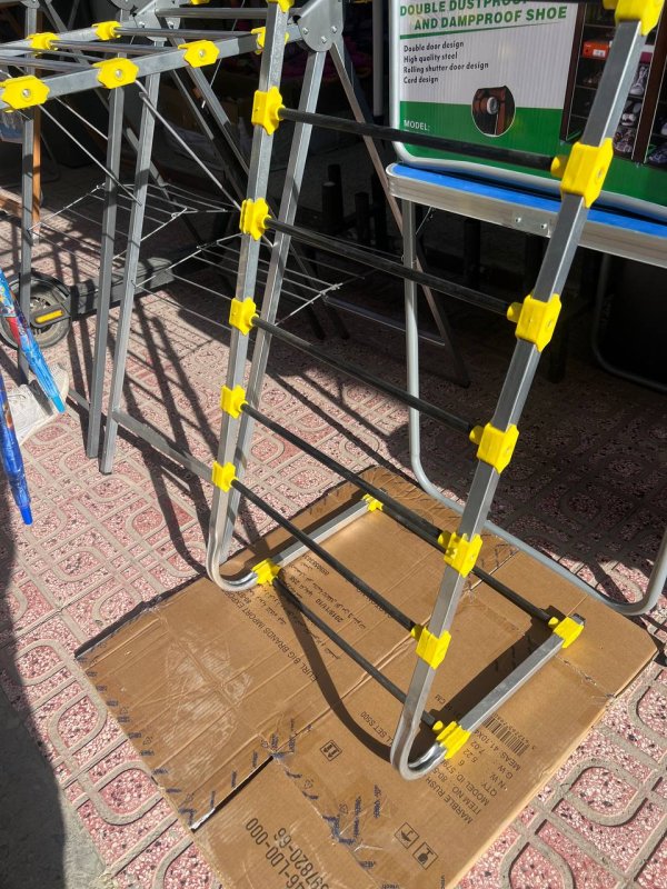 عمودي يُثبت على الرادياتور أو المدفأة Sèche-linge